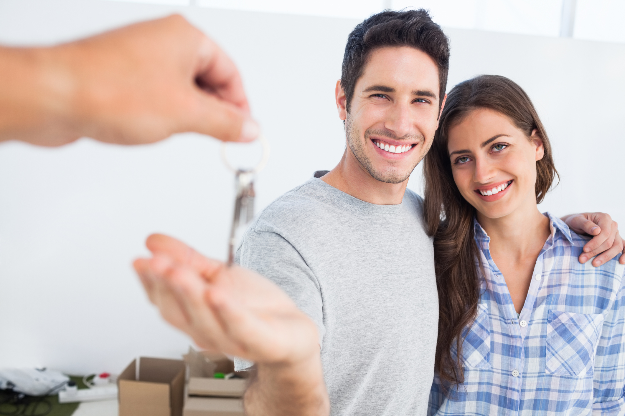 a happy couple being given a house key